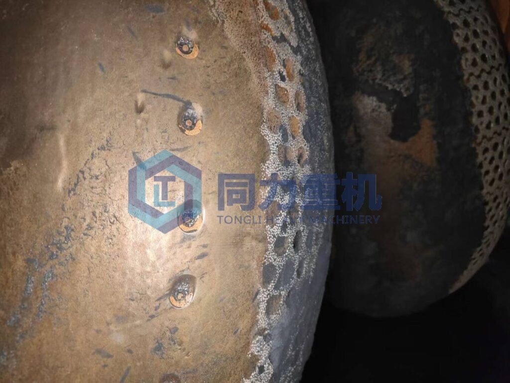 Localized Impact Wear from Oversized Feed or Tramp Metal UBE UM Series Bowl Type Vertical roller mill Grinding Roller Assembly