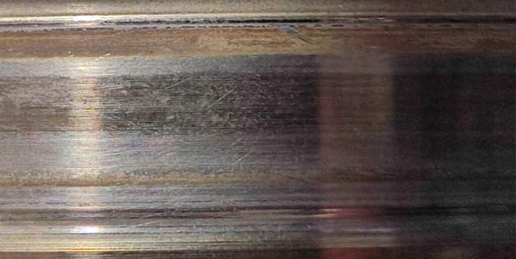 Traces of spherical roller bearing rotation on the shaft. Looseness of the spherical roller bearing seat—the bearing is free to move on the shaft.