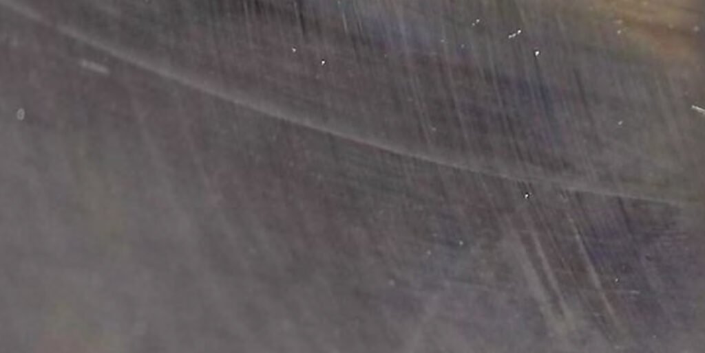 Peeling of roller and outer race surfaces. Numerous dents on the roller and outer race surfaces.