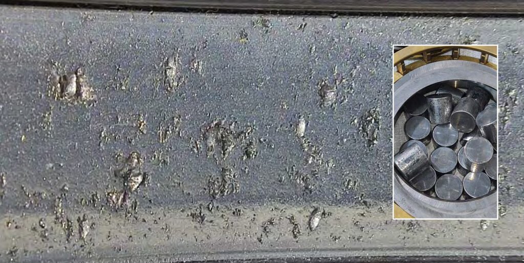 Peeling of roller surfaces, inner and outer races. Numerous dents on roller and race surfaces. Damage to separators.