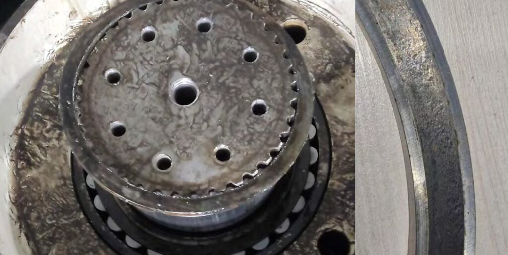 Wear of the carrier spacer ring due to excessive pressure from the turntable.