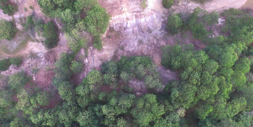 Reclamation of open-pit sites for land creation